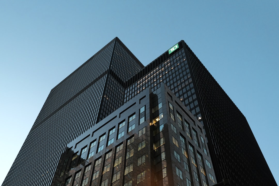 Modern skyscrapers against a clear blue sky.