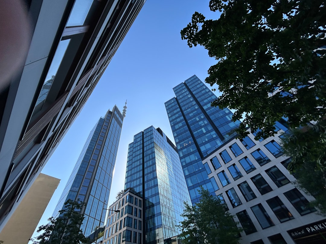 Modern glass skyscrapers against a clear blue sky