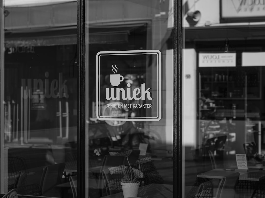 Uniek cafe logo on glass door
